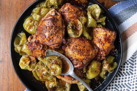 A tangy dressing flavors this recipe for Mex-Italian Chicken Thighs with Roasted Tomatillos