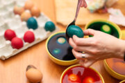hands dying easter eggs
