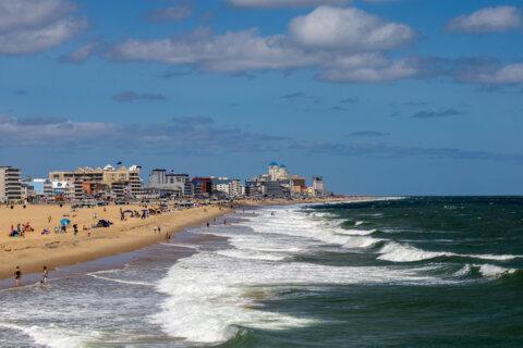 Ocean City, Maryland, USA Sept 3, 2024 People on the beach with big waves.