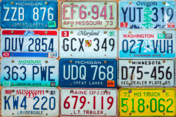 vintage license plates on wall from different states