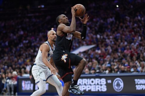 Joel Embiid provides an emotional lift and Tyrese Maxey carries the 76ers into the playoffs