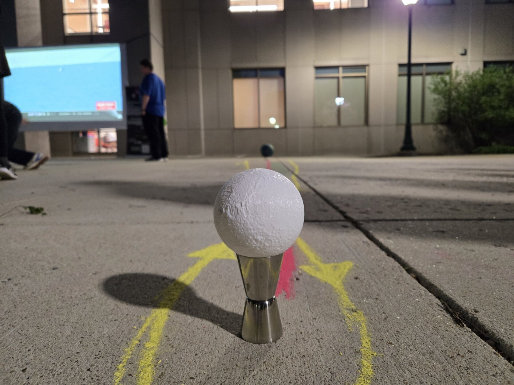 Moon-Earth distance scale model set up near viewing screen.