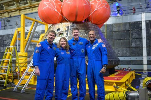 Artemis II’s moon-traveling astronauts return home to cheers after a record-breaking trip