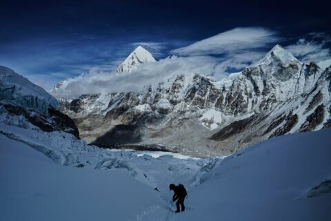 A massive, unstable ice block stalls Everest climbers at base camp