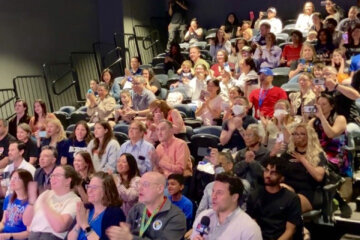 a group of people sat cheering