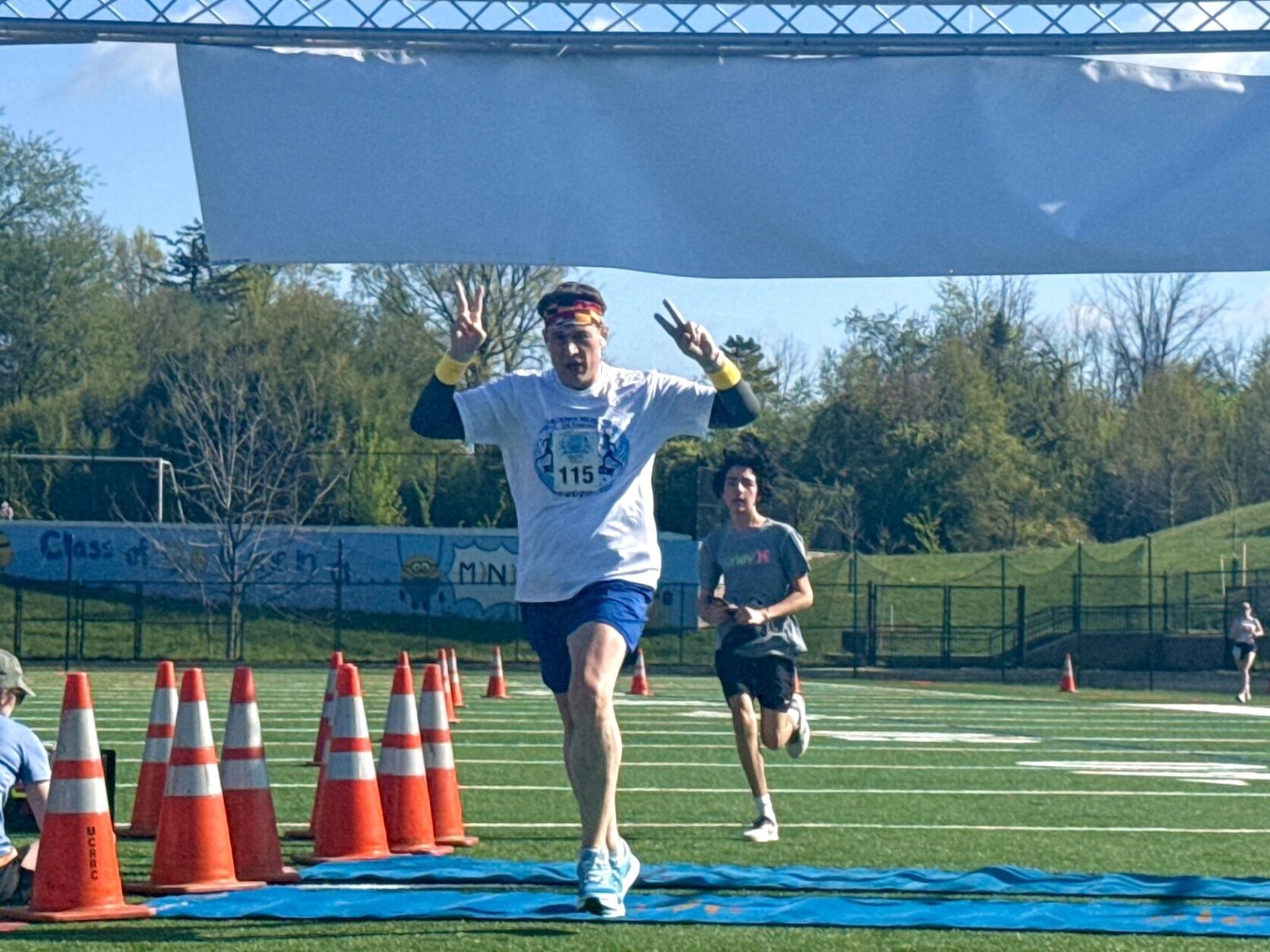 Dr. Taylor crossing the finish line