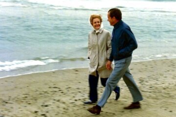 Couple walking on the beach.