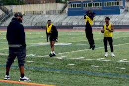 students on a field for Moss football clinic