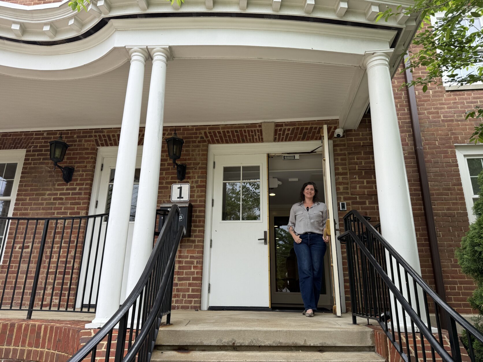 Pastor stands in doorway of renovated church