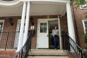 Pastor stands in doorway of renovated church