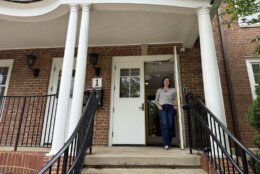 Pastor stands in doorway of renovated church