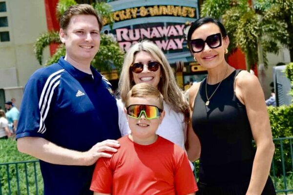 a family smiles for a photo