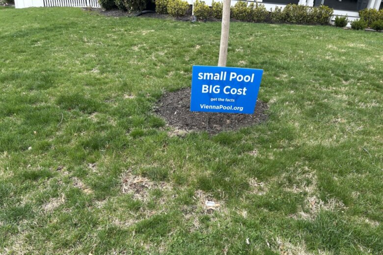 Yard sign protesting construction of local pool