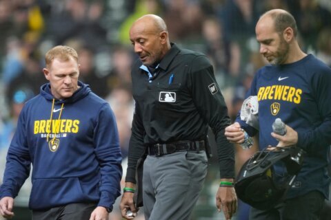 Umpire C.B. Bucknor leaves Rays-Brewers game after foul tip strikes him in his face mask