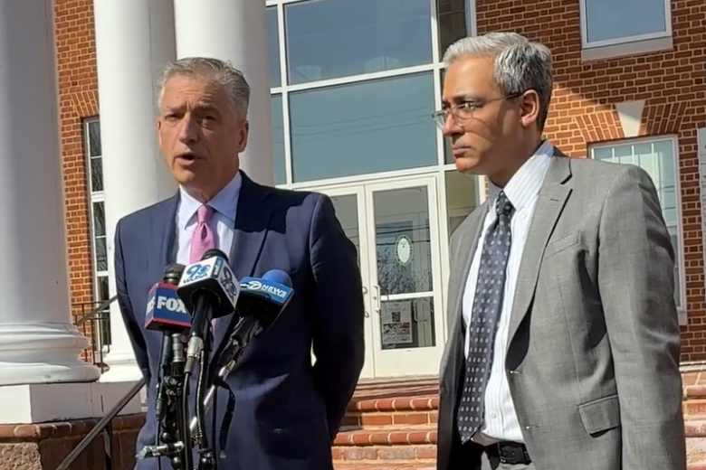 two attorneys speak outside courthouse at news conference