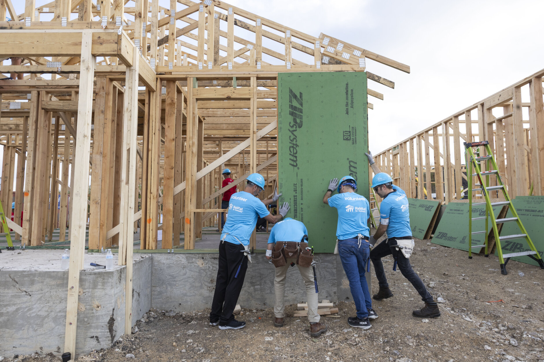 Volunteers working on house