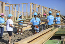 Builders working on house