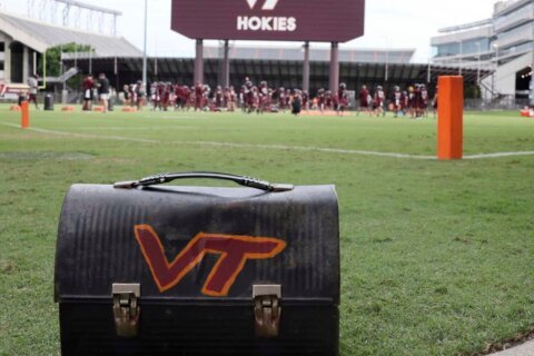 Skydiver gets rescued after crashing into scoreboard before Virginia Tech spring game