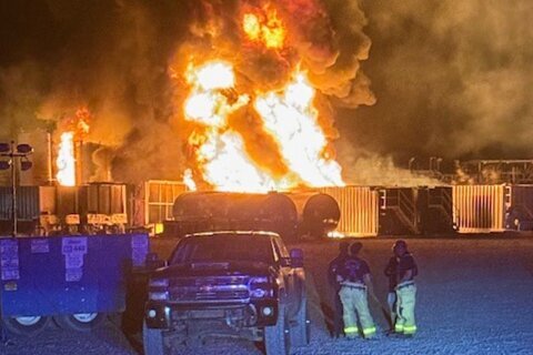A well site explosion triggers a large fire and evacuations in Texas, but no injuries