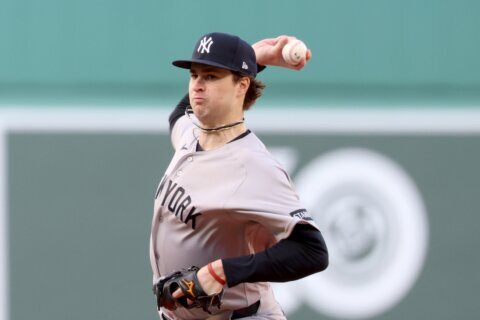 Schlittler says heckling `not too bad' as he pitches at Fenway Park for first time against Red Sox