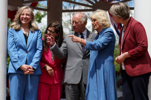 Left to Right; Virginia Gov. Abigail Spanberger, Front Royal Mayor Lori A. Cockrell, Britain's King Charles III, Queen Camilla, and Secretary of State for Foreign and Commonwealth Affairs of the United Kingdom Yvette Cooper attend a parade and block party event Thursday, April 30, 2026, in Front Royal, Va. (Win McNamee/Pool Photo via AP)