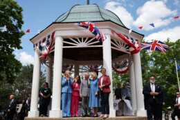 Left to right; Virginia Gov. Abigail Spanberger, Front Royal Mayor Lori A. Cockrell, Britain's King Charles III, Queen Camilla, and Secretary of State for Foreign and Commonwealth Affairs of the United Kingdom Yvette Cooper attend a parade and block party event Thursday, April 30, 2026, in Front Royal, Va. (Win McNamee/Pool Photo via AP)