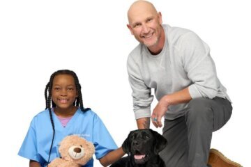 BJ Radhe and a child with a dog