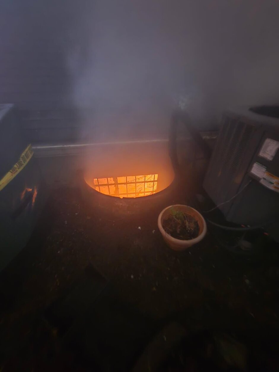 window of basement glows orange