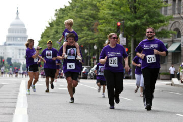 WASHINGTON, DC - JUNE 16:  Runners approach the finish line at the Pancreatic Cancer Action Network's PurpleStride 5K Run/Walk on June 16, 2012 in Washington, United States.  (Photo by Paul Morigi/Getty Images)