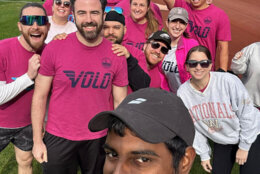 The couple pose with their kickball teammates.