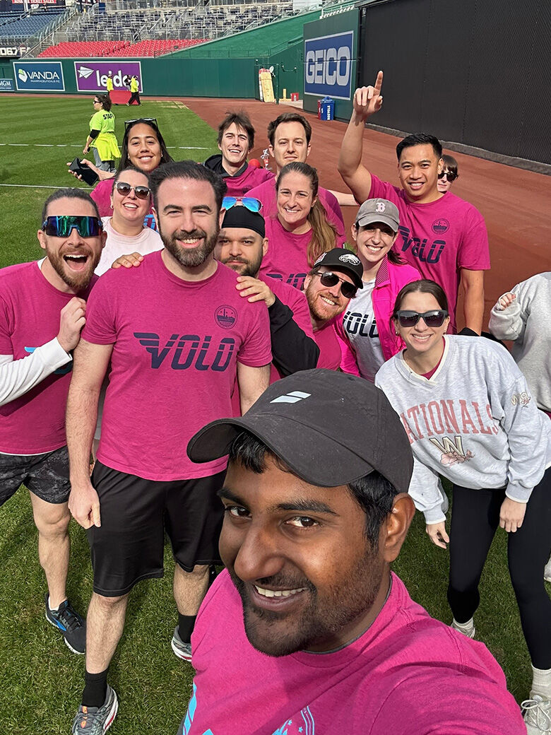 The couple pose with their kickball teammates.