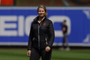 Baltimore Orioles head groundskeeper Nicole Sherry looks on prior to a baseball game between the Baltimore Orioles and the Milwaukee Brewers at Oriole Park at Camden Yards, Monday, April 11, 2022, In Baltimore. The Orioles won 2-1. (AP Photo/Julio Cortez)