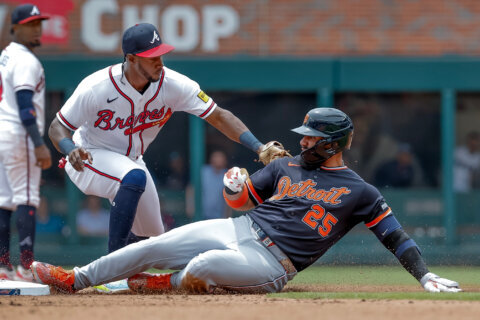 Tigers 2B Torres taking a break from swinging a bat as he works to return from left oblique strain
