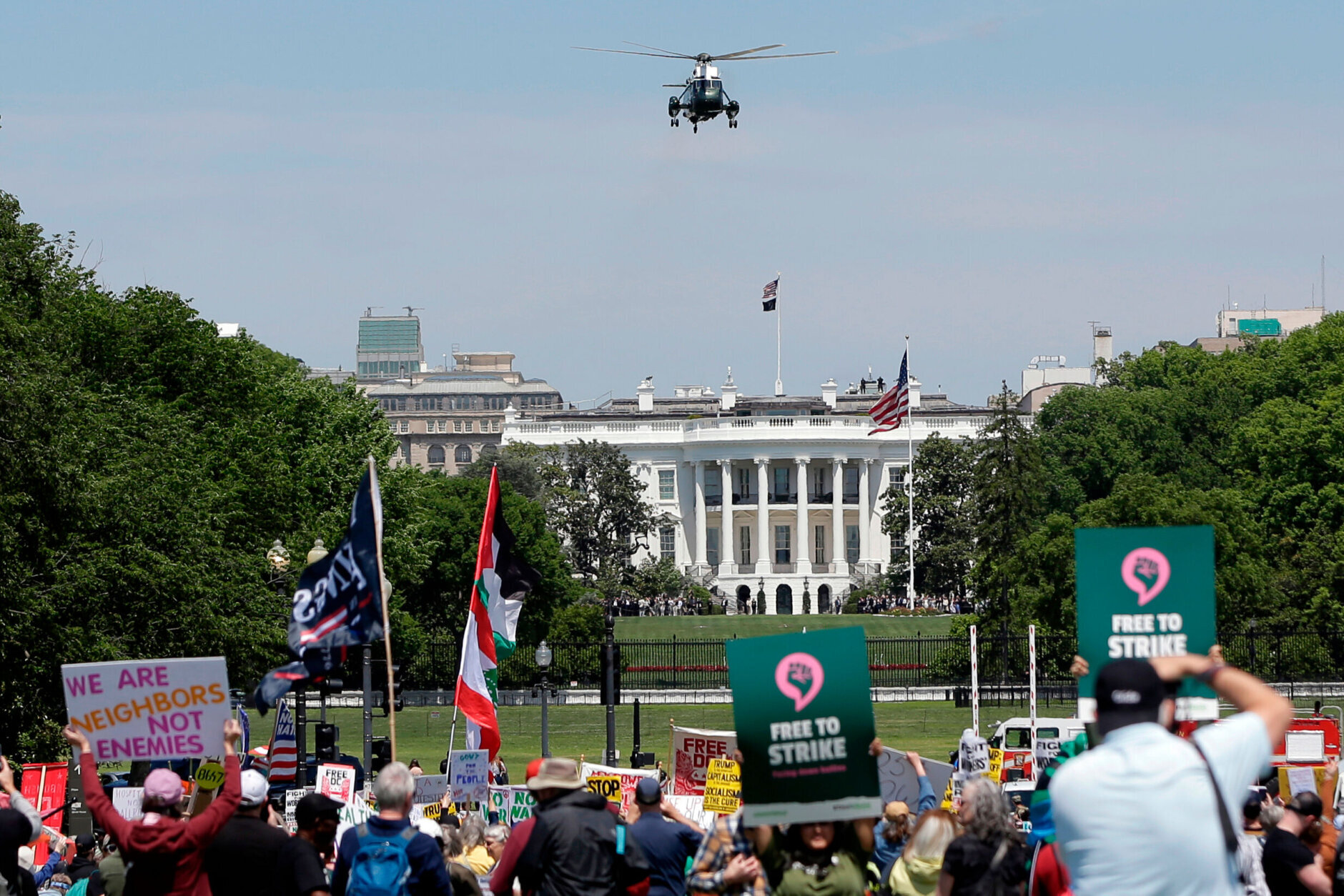 Marine One with President Donald Trump aboard, departs from the South Lawn of the White House as demonstrators rally at the National Mall during a May Day protest Friday, May 1, 2026, in Washington. (AP Photo/Rahmat Gul)