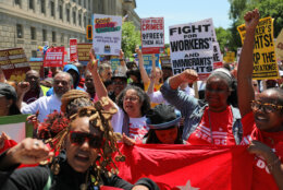 Demonstrators rally near the National Mall during a May Day protest Friday, May 1, 2026, in Washington. (AP Photo/Rahmat Gul)