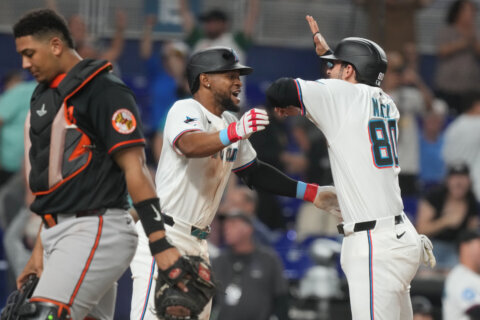 Marlins beat the Orioles 4-3 on a 9th-inning throwing error to avoid series sweep