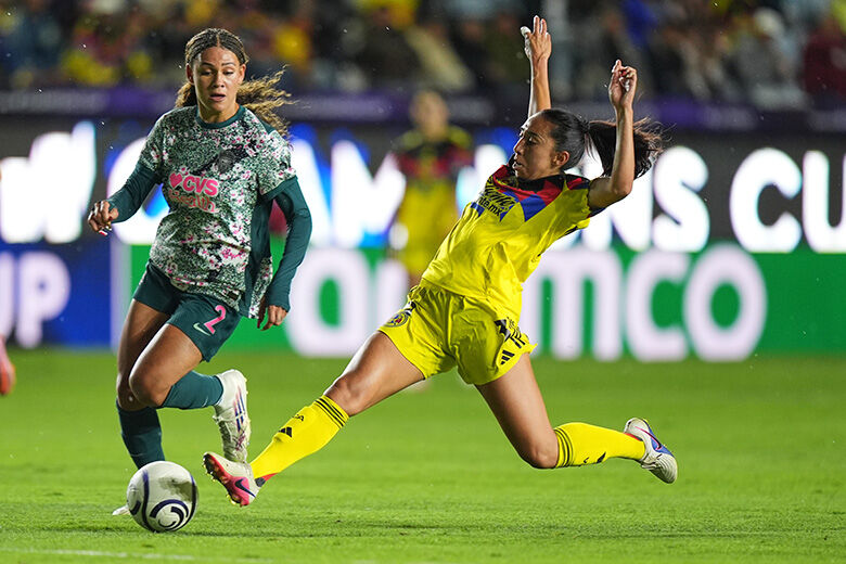 Karina Rodriguez of Mexico's America, right, challenges Trinity Rodman of The United States' Washington Spirit during the Women's CONCACAF Champions Cup final soccer match in Pachuca, Mexico, Saturday, May 23, 2026.(AP Photo/Fernando Llano)