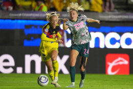 Sarah Luebbert of Mexico's America, left, and Esme Morgan of The United States' Washington Spirit compete for the ball during the Women's CONCACAF Champions Cup final soccer match in Pachuca, Mexico, Saturday, May 23, 2026.(AP Photo/Fernando Llano)