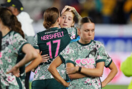 Hal Hershfelt comfort her teammate Sandy MacIver of The United States' Washington Spirit, after losing against Mexico's America during the Women's CONCACAF Champions Cup final soccer match in Pachuca, Mexico, Saturday, May 23, 2026.(AP Photo/Fernando Llano)