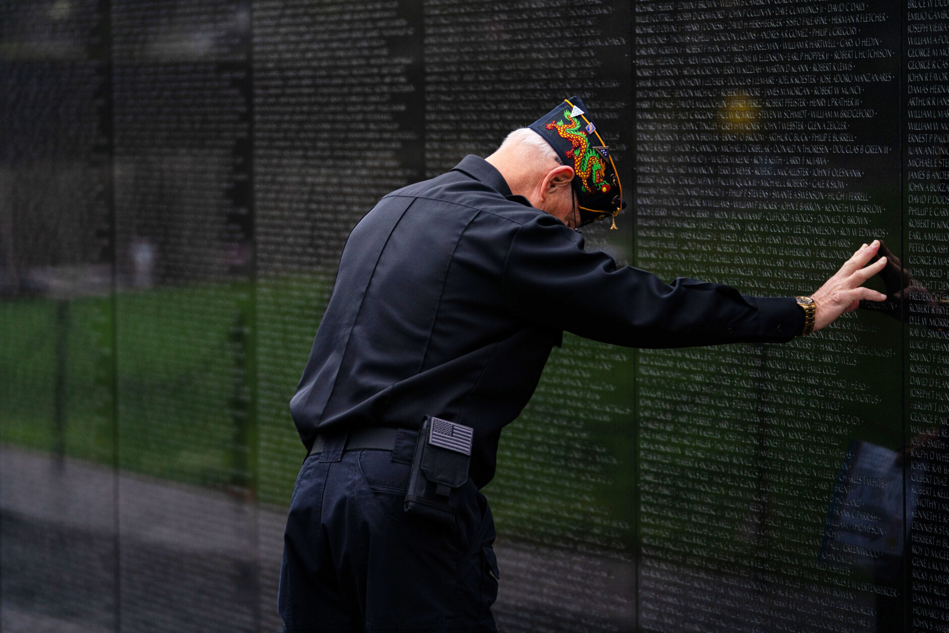 A veteran pays respects at the Vietnam Veterans Memoria