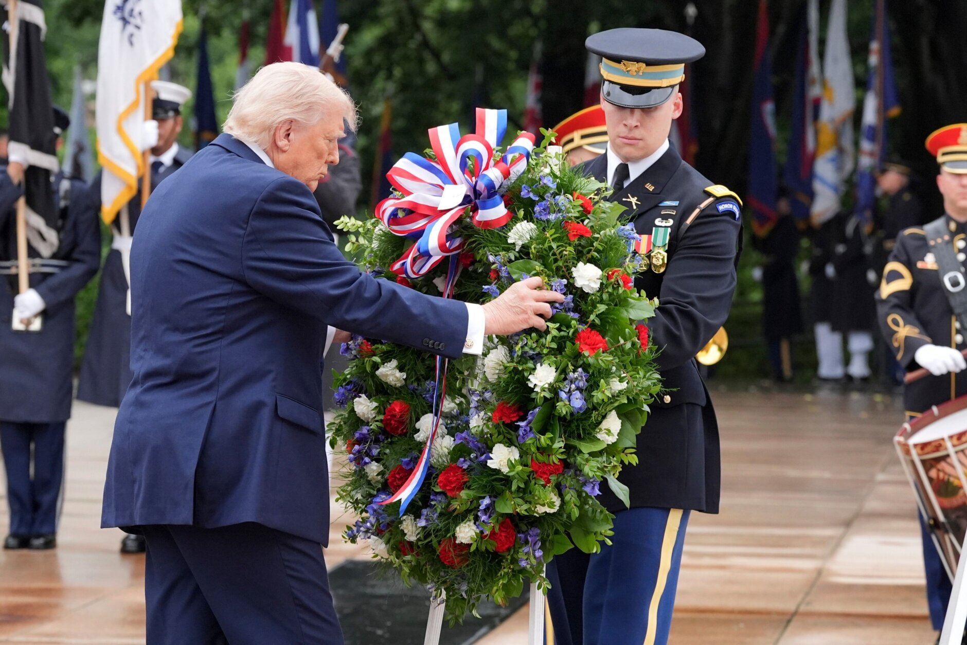 President Donald Trump places a wreath at the Tomb of the Unknown Soldier in Arlington National Cemetery