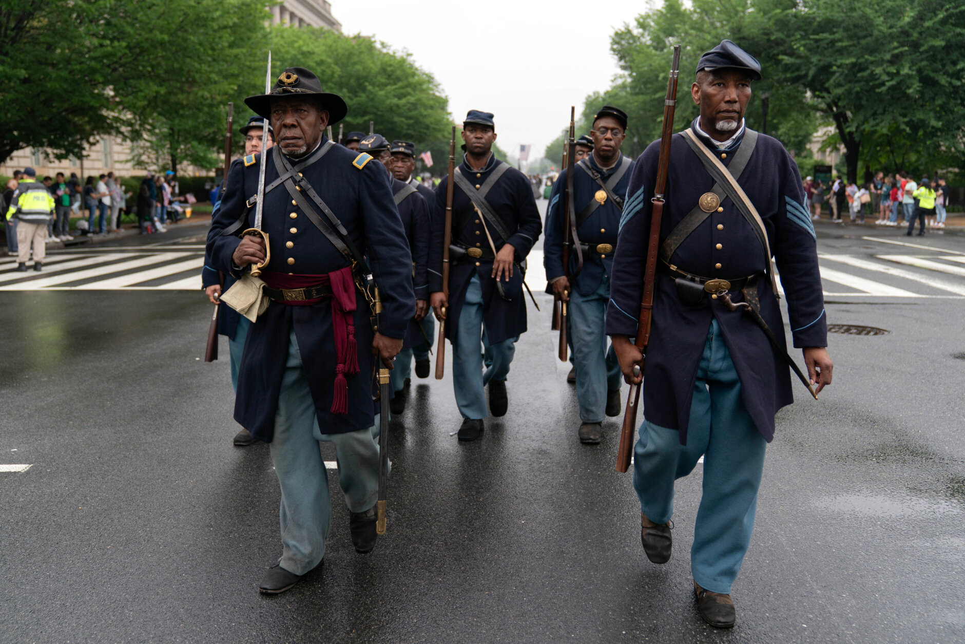 Participants dressed in civil war Union Army uniforms march during a parade in Washington to commemorate Memorial Day