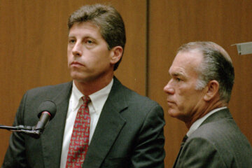 With his attorney, Darryl Mounger, at his side, right, former Los Angeles Police Detective Mark Fuhrman invoked his Fifth Amendment rights during the O.J. Simpson double-murder trial in Los Angeles, Sept. 6, 1995. Former Los Angeles police detective Mark Fuhrman, who was convicted of lying during testimony at the O.J. Simpson murder trial, has died. He was 74. (AP Photo/Hal Garb, Pool)