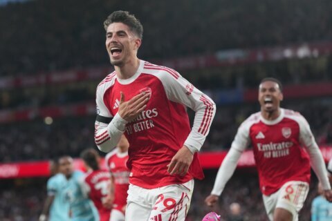 Arsenal wins its first Premier League title in 22 years after Man City draws with Bournemouth