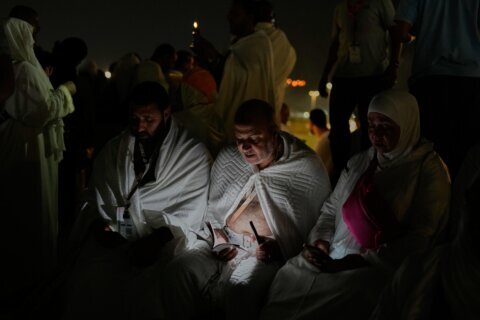Muslim pilgrims converge on Mount Arafat in Saudi Arabia as the Hajj reaches its peak