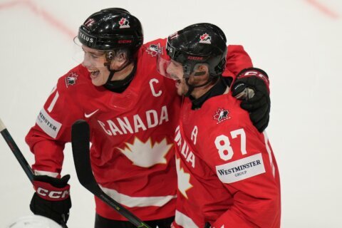 Celebrini and Crosby score as Canada beats US to advance to semifinals of ice hockey worlds