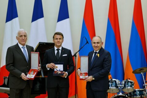 Macron croons classic ballads at a state dinner in Armenia for the French leader