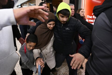 19 Australian women and children linked to Islamic State group set to return from Syria