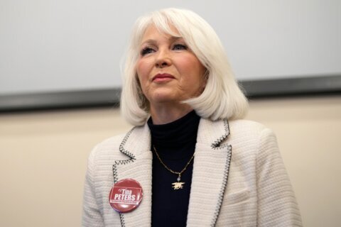 Colorado’s Democratic governor commutes ex-election clerk Tina Peters’ sentence after Trump pressure