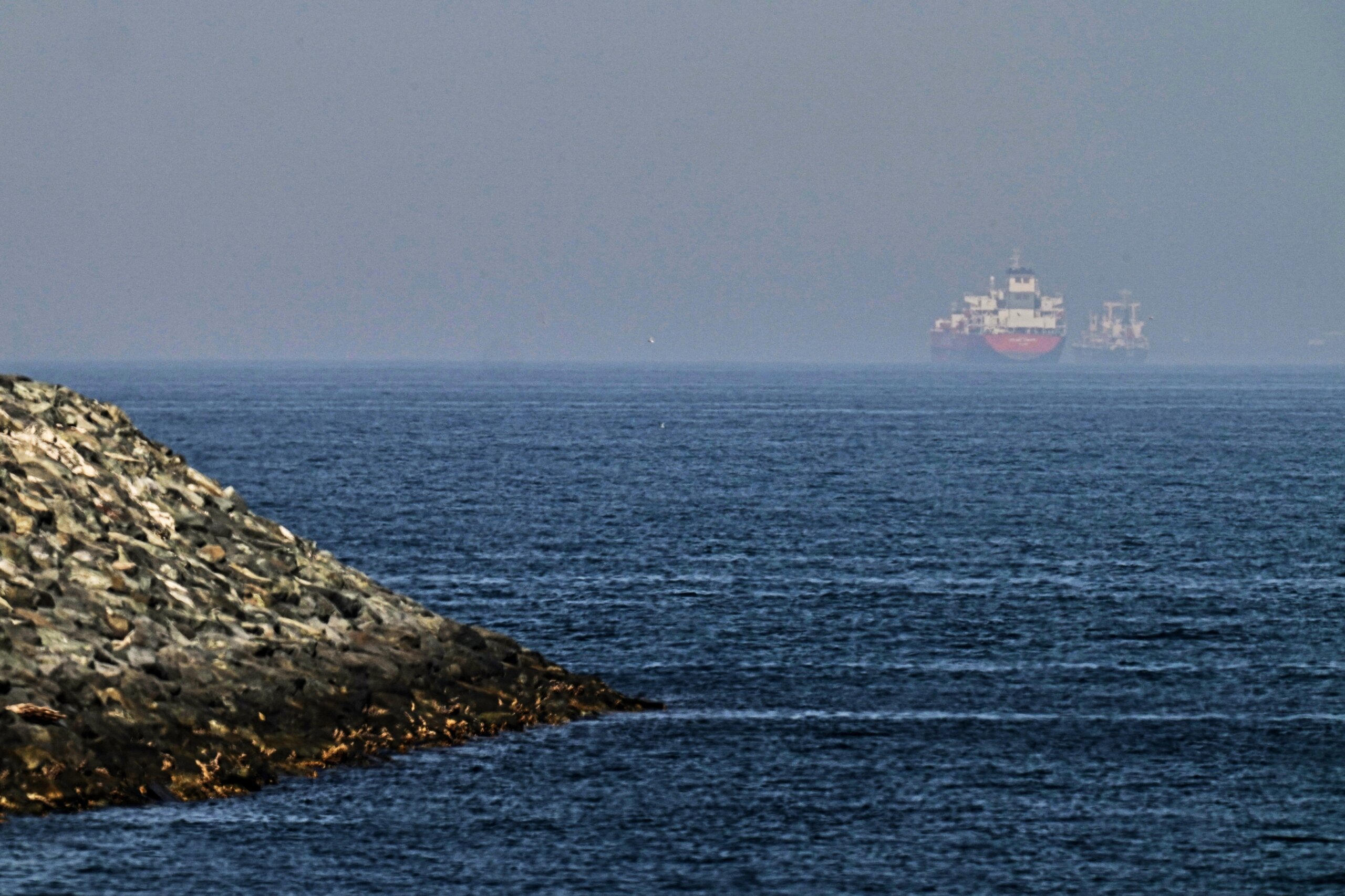 US claims progress in reopening the Strait of Hormuz, saying 2 merchant ships have transited